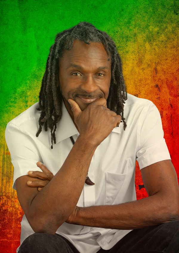Contemporary Reggae Artist smiling in headshot | Altus Entertainment